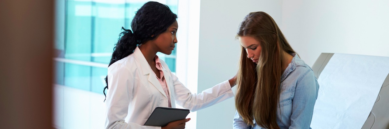 3 Effects of Doctors Not Believing My Dysautonomia Doctor Talking To Unhappy Teenage Patient In Exam Room