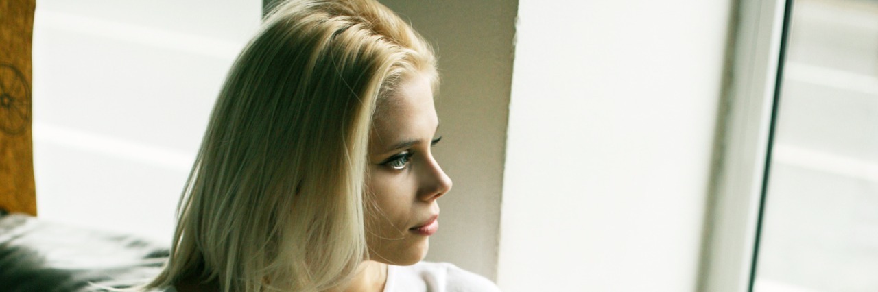 How We Can Spread Endometriosis Understanding and Advocacy woman using phone at home.