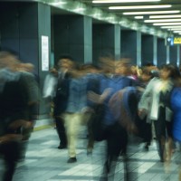 People walking down passage in station, blurred motion, Tokyo, Japan