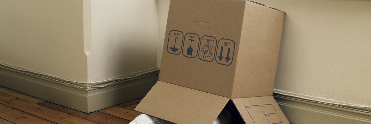 Woman in cardboard box