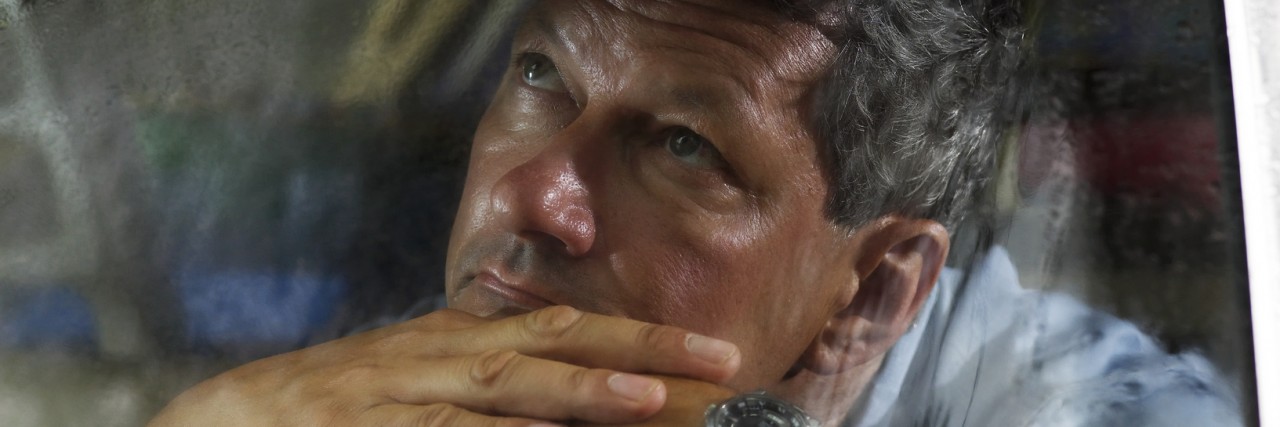 Hiding With Anxiety and Depression Man looks out car window