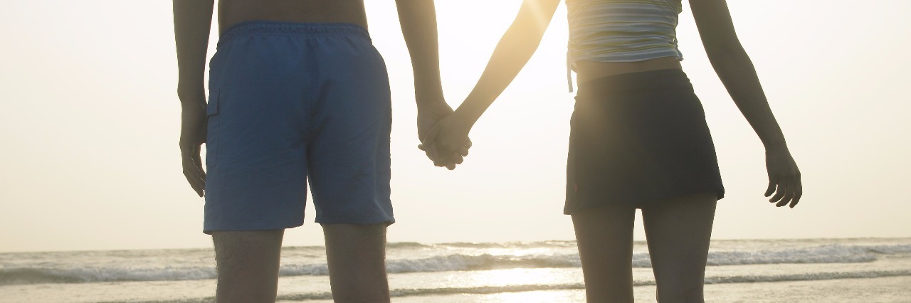 A Letter to the Love of My Life From Your Partner With Anxiety couple holding hands on beach