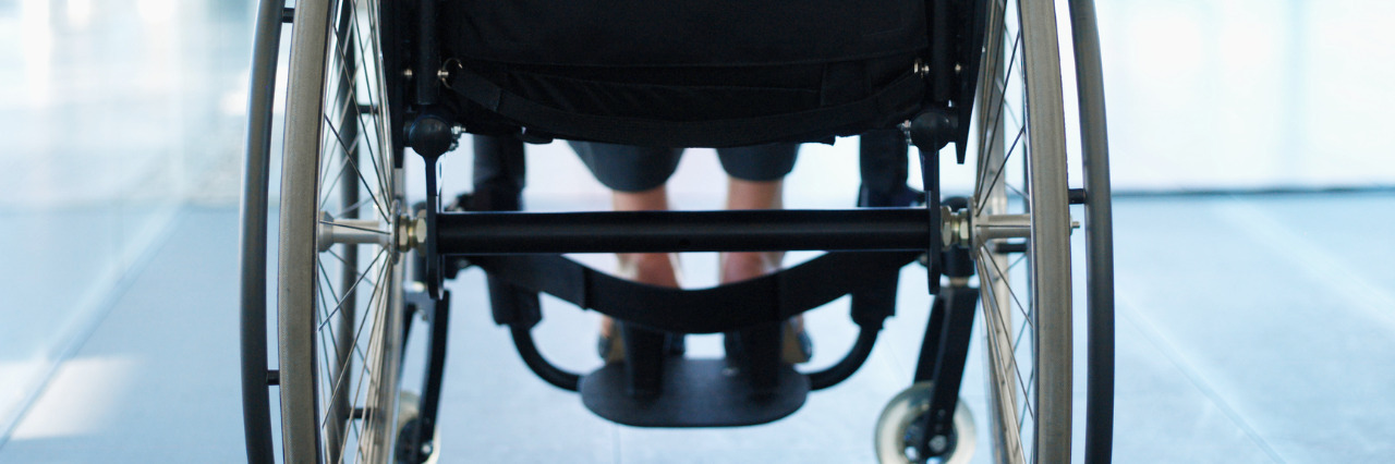 Realizing a Wheelchair Doesn't Mean 'Giving Up' Woman sitting in a wheelchair in an office building.