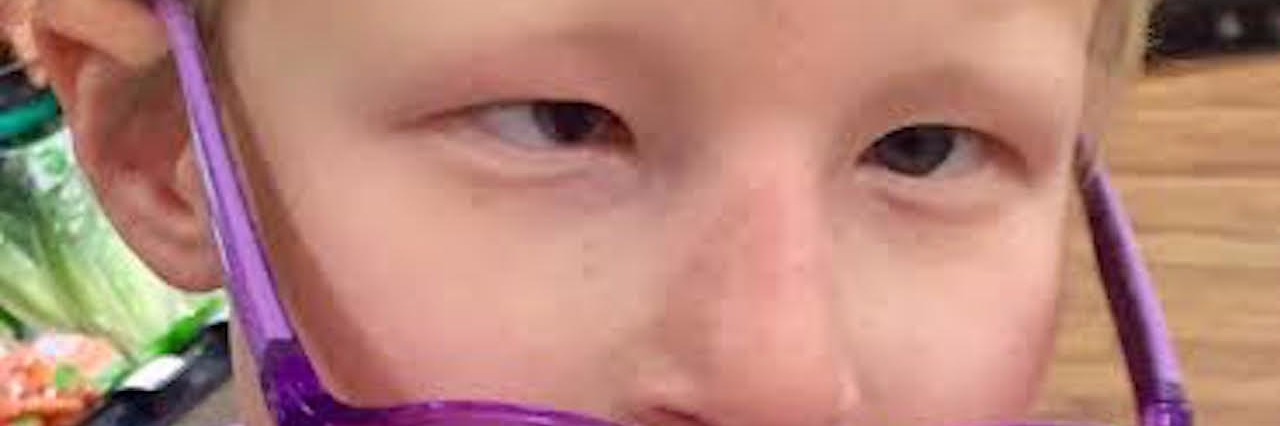 The Special Needs Parenting Story I Hear in This Children's Song girl wearing glasses