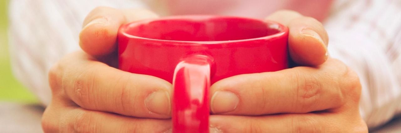 How to Simplify Household Tasks With Fibromyalgia hands on coffee cup