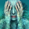 Surreal and artistic image of a girl who covers her eyes with her hands on a background of trees and sky
