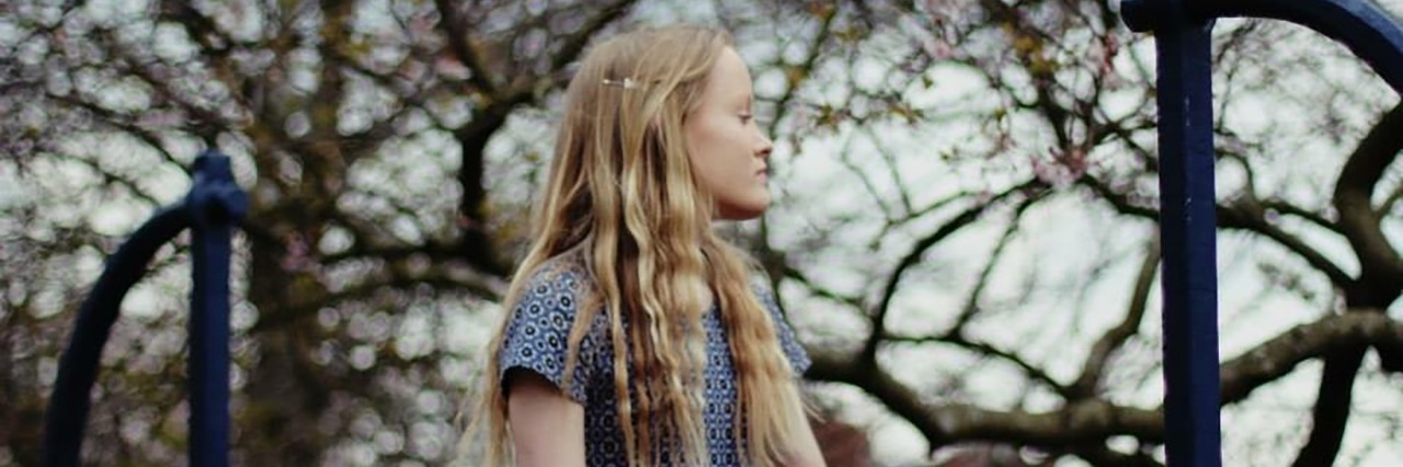 Depression and Guilt: There Is Always Hope girl surrounded by trees looking towards something