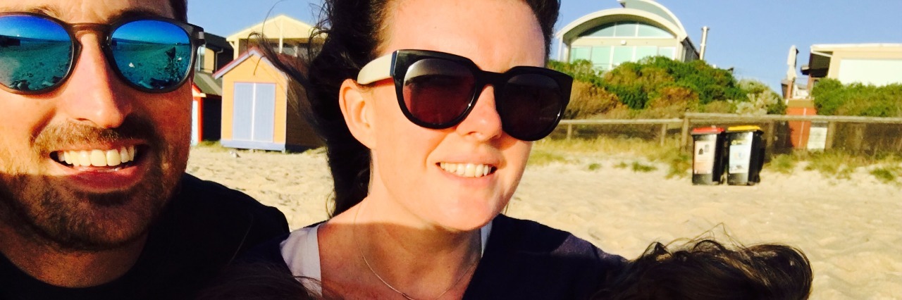20 Things to Know If You Got a Difficult Diagnosis family of parents and two little kids at beach