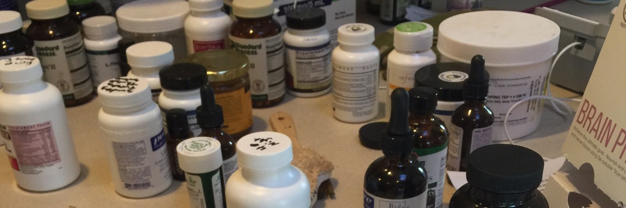 Advice for Living With a Chronically Ill Roommate pill bottles on a table