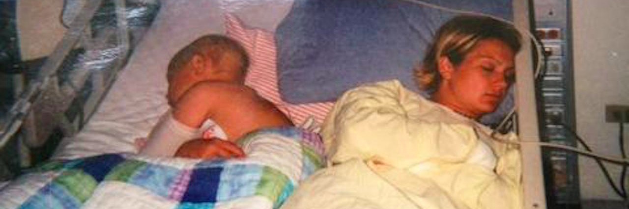 Woman Creates 'Brave Gowns' After Losing Brother to Pediatric Cancer woman and young boy asleep together in hospital bed