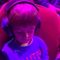 young boy wearing headphones and sleeping