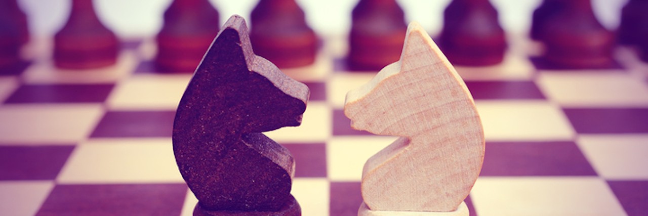 Living With Obsessive-Compulsive Disorder Is Like a War Two knight on a chessboard. Confrontation.