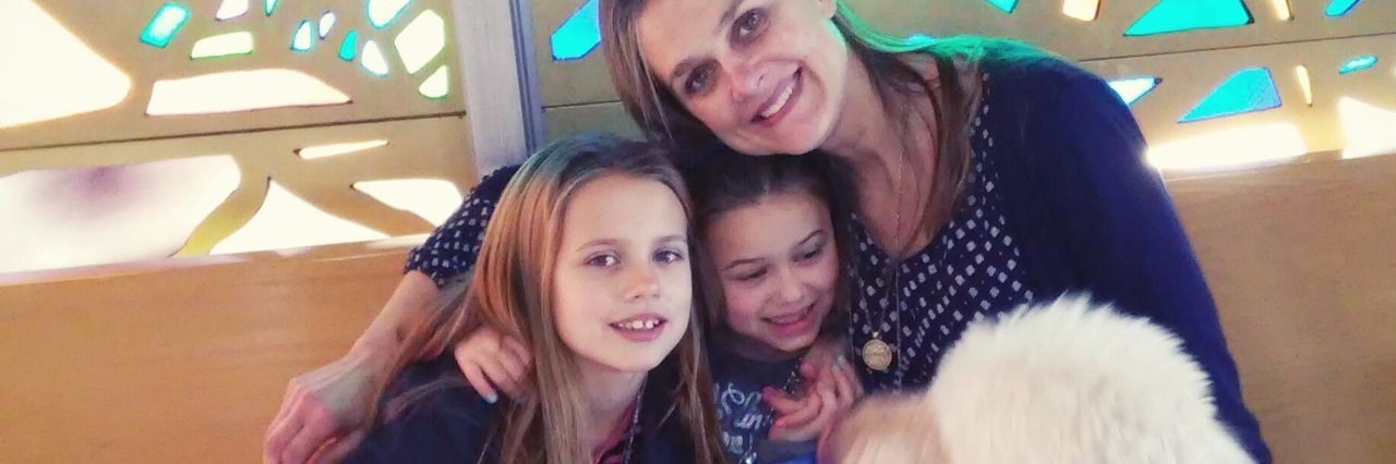 Using My 'Blessing Jar' to Cope With Anxiety and Worry Mom and two girls sitting with service dog