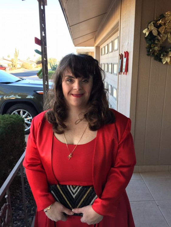 girl with down syndrome wearing red dress