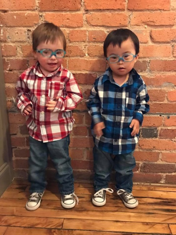 twin boys with down syndrome wearing plaid shirts