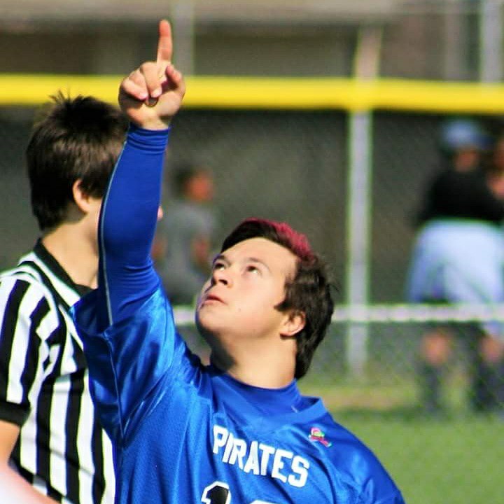 man with down syndrome playing football