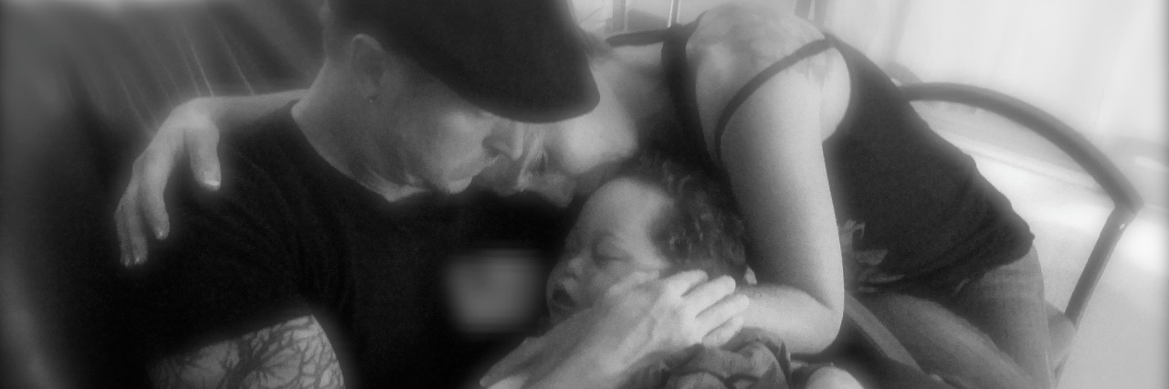 A Letter to My Husband After Our Child's Passing The author with her husband and son
