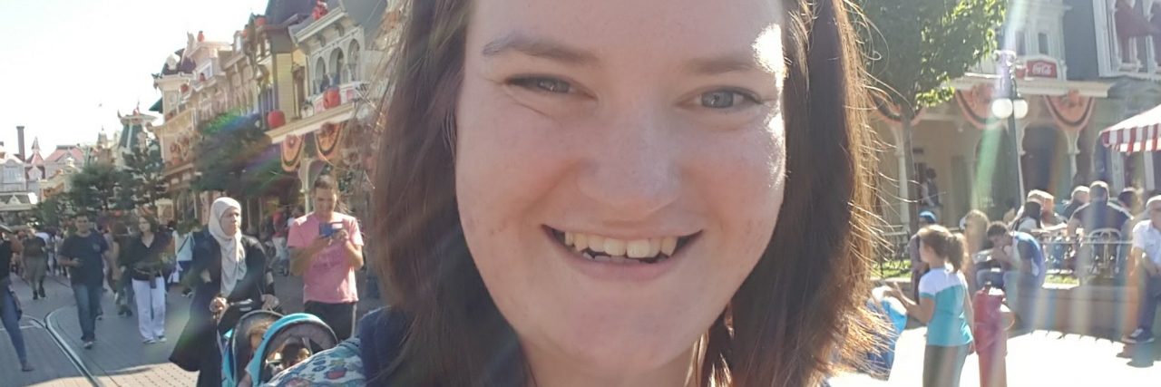 I'm Afraid of Dogs. Here's How You Can Help Me Deal With That Phobia. woman with minnie mouse ears