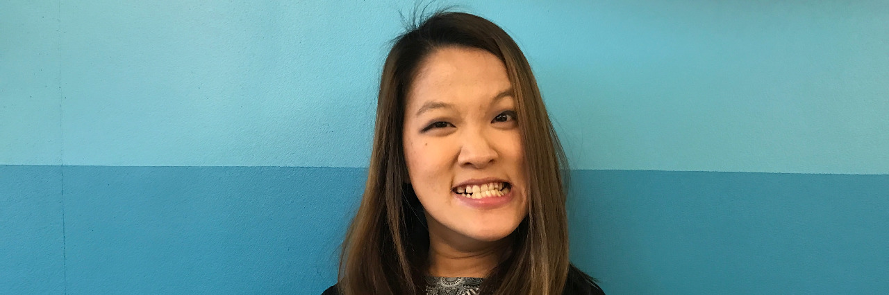 How We Can Help Beat Bullying of People With Disabilities Sarah Kim, a young woman with cerebral palsy, holds up a sign saying 'I beat bullying by standing against the R-word!'