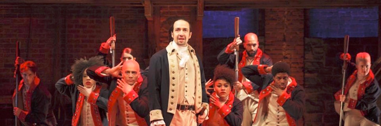 Talking About ‘Hamilton’ With My Son With Asperger’s A shot of the musical with Alexander Hamilton at the front and ensemble in the back