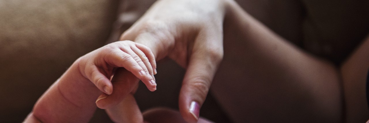 mom and baby's hand