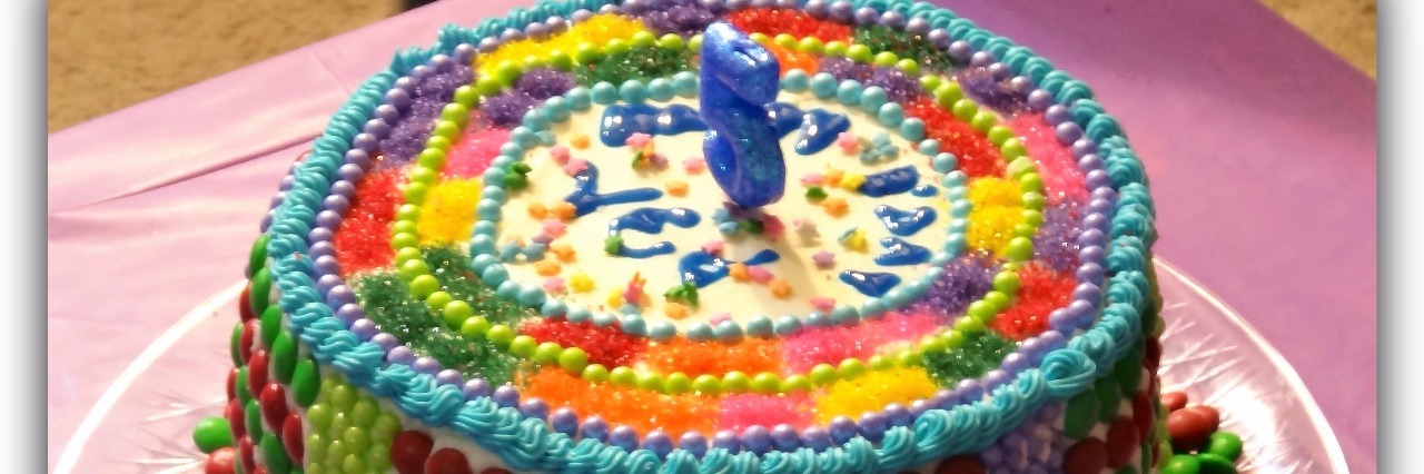 homemade cake with colorful candy and chocolate pieces