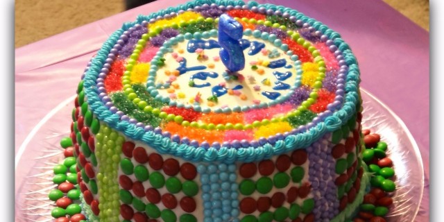 The Stories I Weave Into the Birthday Cakes of My Son on the Autism Spectrum homemade cake with colorful candy and chocolate pieces