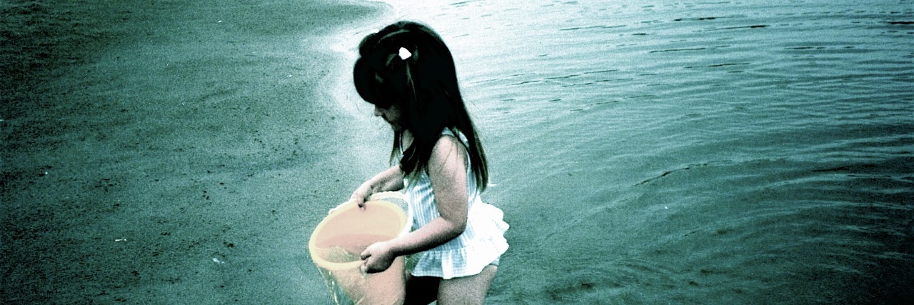 Having Dreams as an Adult With Chronic Illness young girl holding a bucket and standing in shallow water