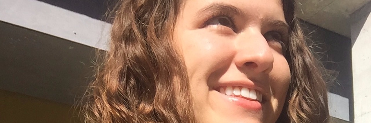 The Text I Got After a Co-Worker Saw Me Having a Panic Attack smiling girl