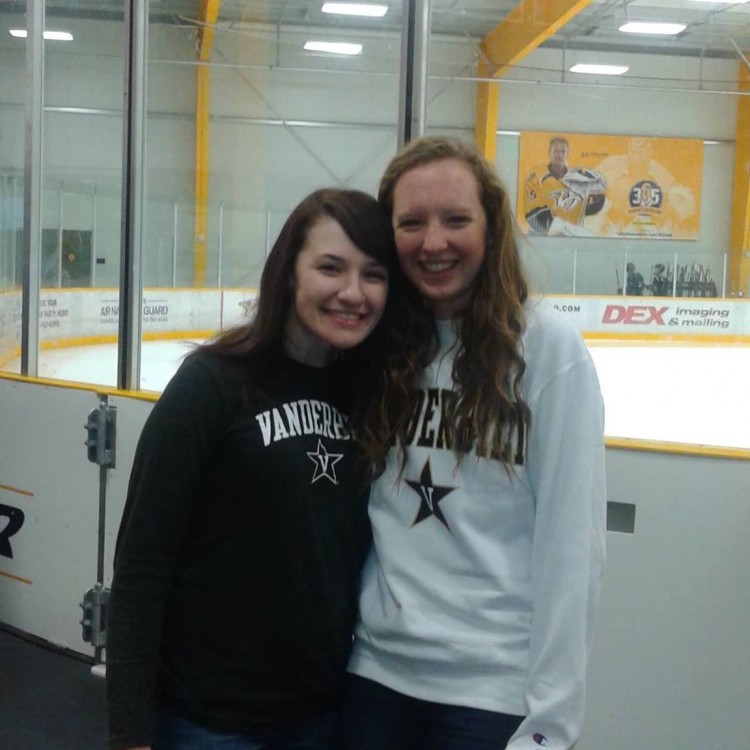 Two women smiling together in college