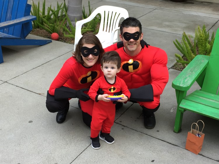 A family of three dressed as the Incredibles.