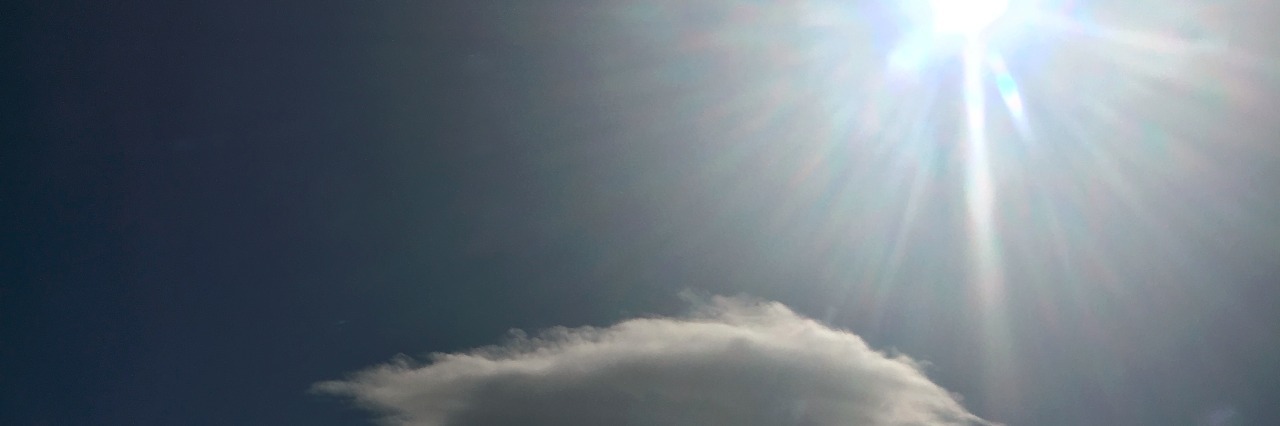 Grieving the Loss of My Son A blue sky with a cloud and the sun shining