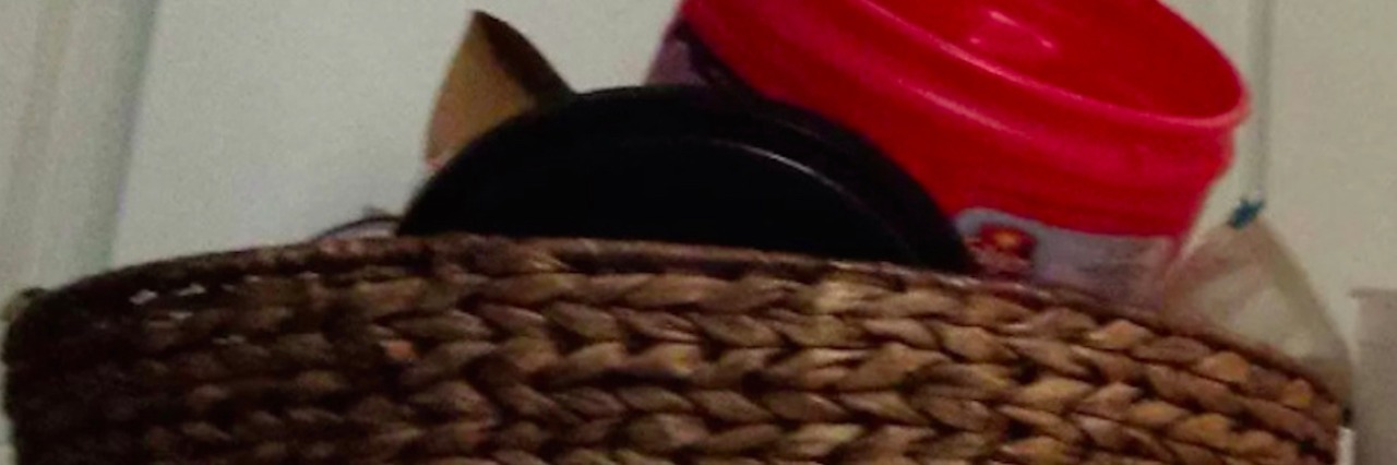 My Son on the Autism Spectrum and Collecting Unique Items plastic Folgers coffee canister in brown wicker basket