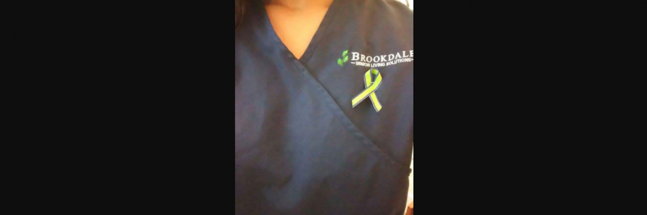 Why I'm Opening Up About Being Bullied for Having Trichotillomania woman with b f r b ribbon
