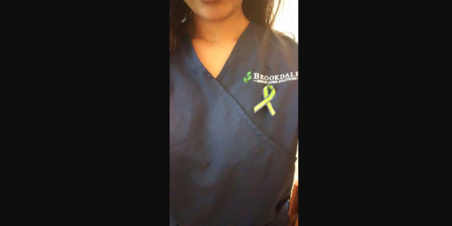 Why I'm Opening Up About Being Bullied for Having Trichotillomania woman with b f r b ribbon