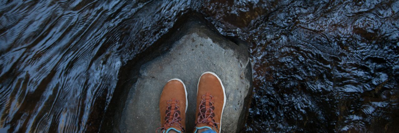 How I'm Learning to Combat Depression With 'Little Victories' girl standing on a rock in the water