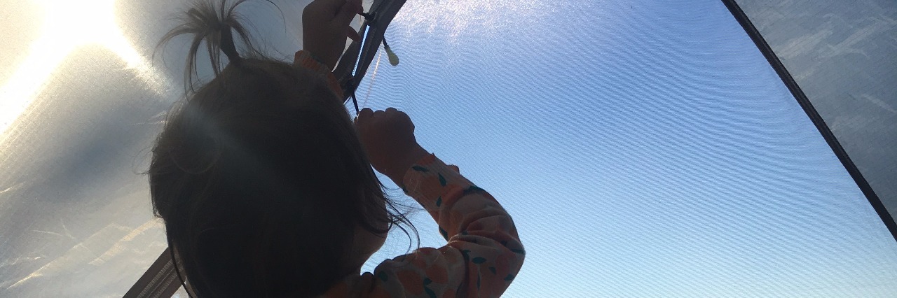 The Important of Whole Exome Sequencing for KIF1A Mutation girl looking out of tent window