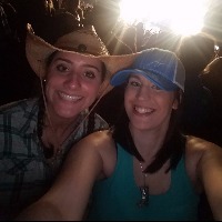 Two friends at a country music concert.