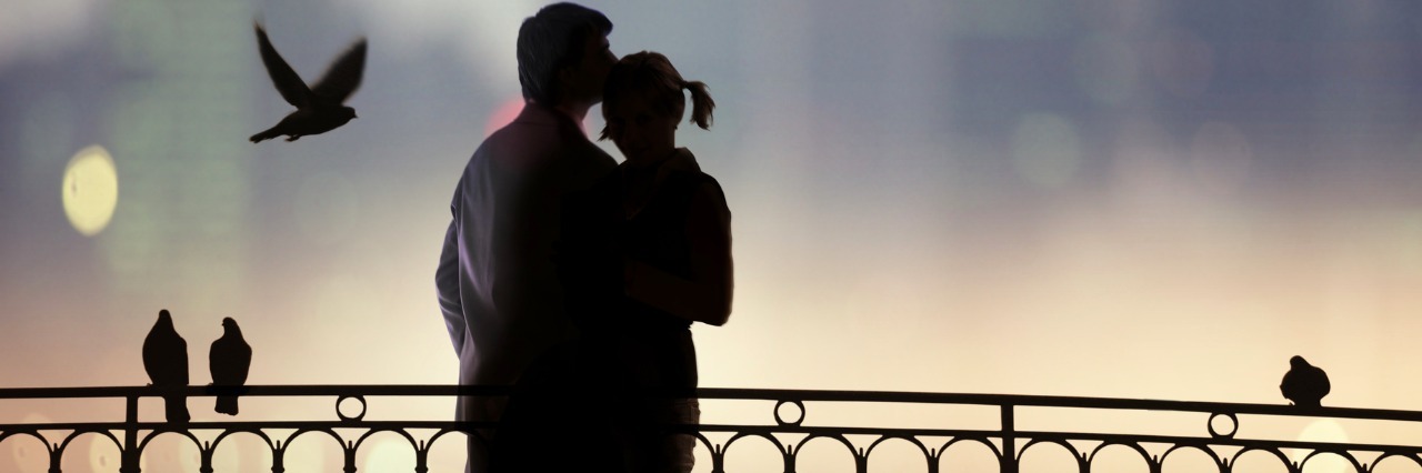 What It Entails to Love a Person With a Congenital Heart Defect silhouette of bridge and pair of lovers on city background