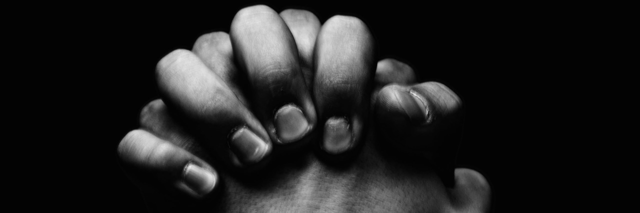 To the Christian Who Told Me to Stop Taking Antidepressants man holding his hands together in prayer