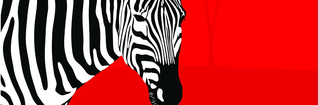 Why We Need to 'Think Zebras' on Rare Disease Day zebra on red background