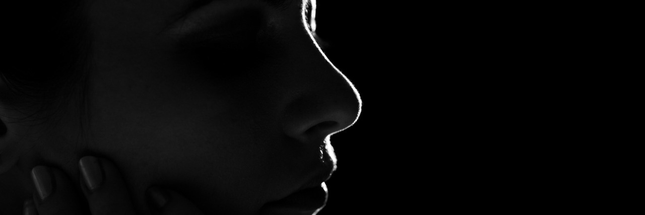 The Emptiness of an Early Miscarriage Black and white profile of woman