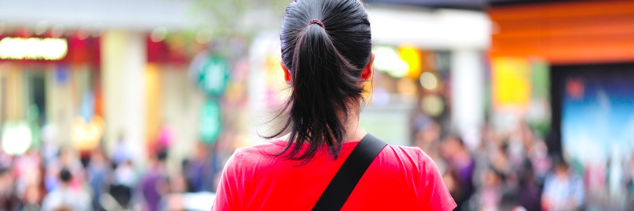 Why We Need More Autism Acceptance woman facing crowded mall