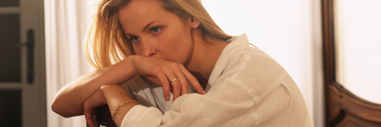 'What Is Happening to My Body?' Understanding Functional Neurological Woman sitting pensively