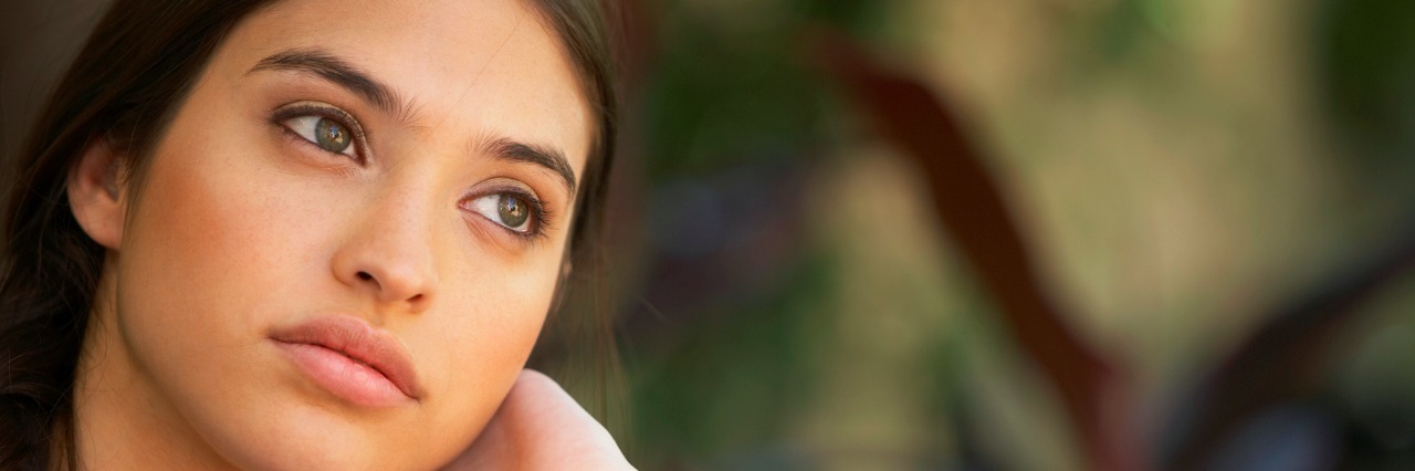 Is Eating Disorder Recovery Really Worth It? Young woman looking away, close-up