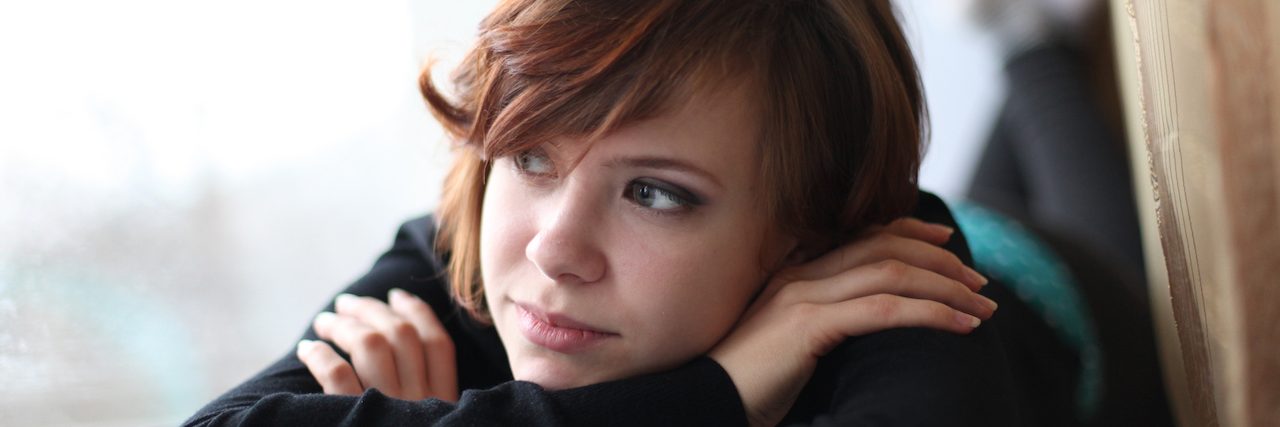 Depression or Sadness: How to Know the Difference A girl laying down