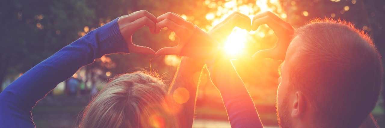 To My Newly-Diagnosed Friend, From Someone Who's Been in Your Shoes man and woman holding hands in heart shape above heads