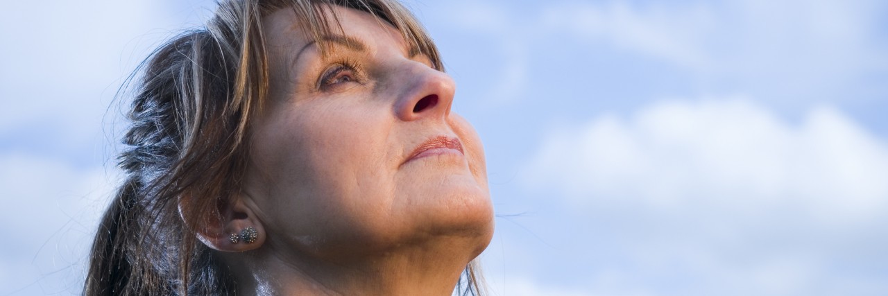 mature woman look in the sky