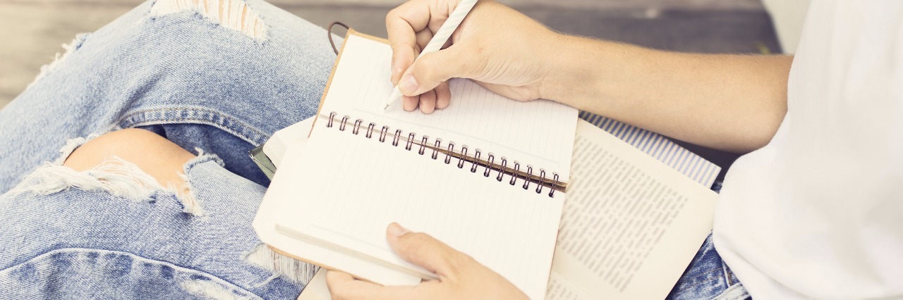 Chronic Illness: Thank You Letter to Future Partner woman sitting on the floor and writing a letter