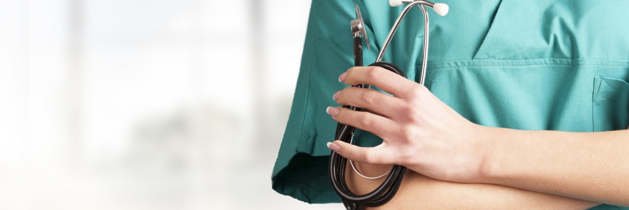 We Need More Doctors With Disabilities Doctor in green uniform.